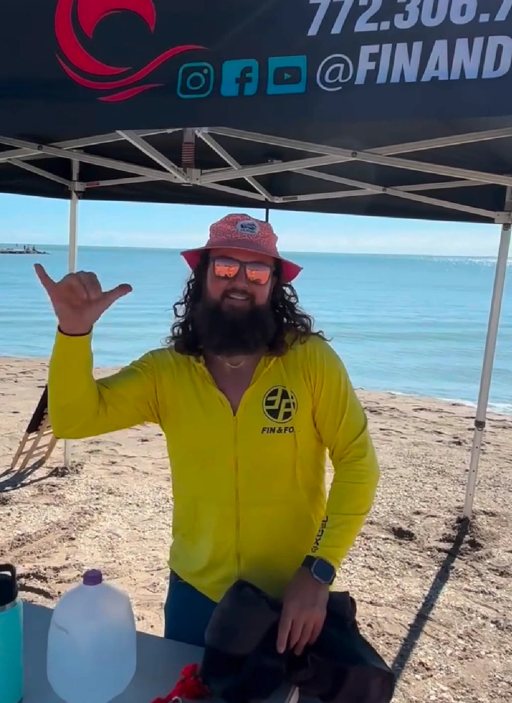 Chris Trappy at the Fin & Foil beach tent before a lesson