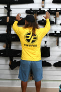 Yellow Xcel VentX long-sleeve rash guard,back view. Hydrofoil display background